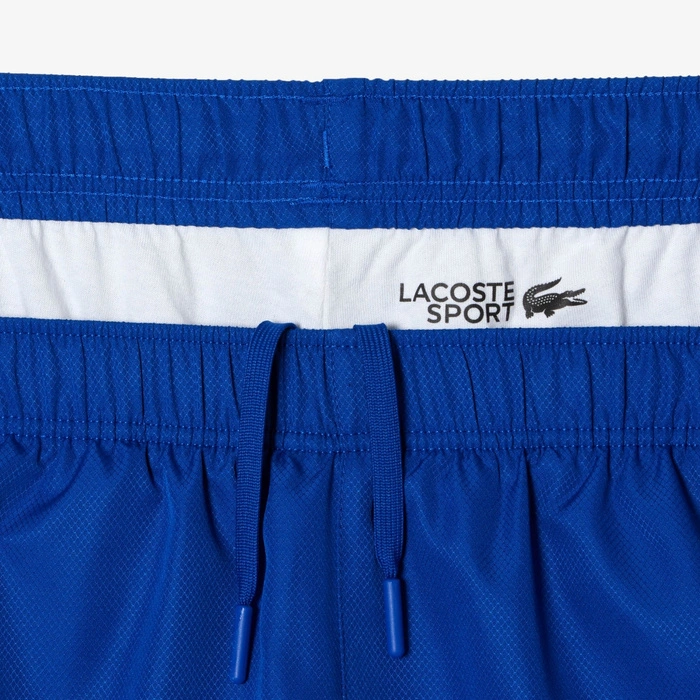 Kompletny męski dres Lacoste Sport spodnie + kurtka niebieski r. XS